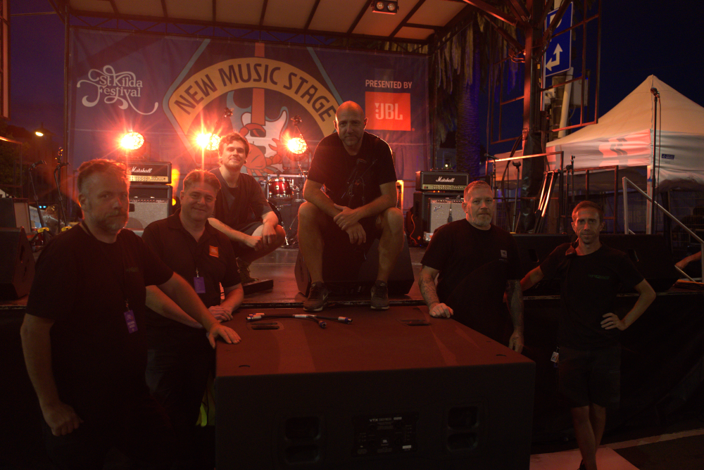 6 men from the sound and production team in front of st kilda festival's new music stage